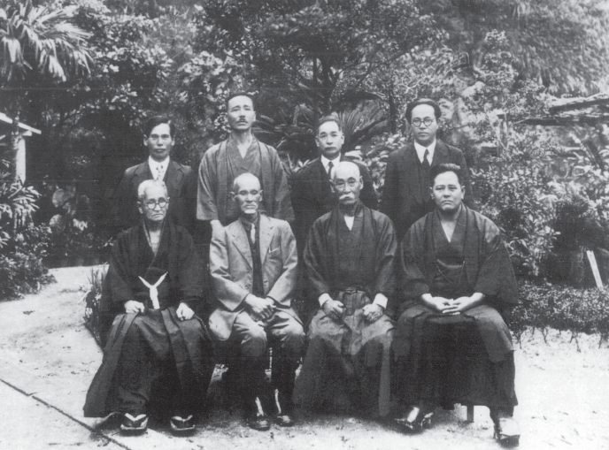 Group photograph of prominent Okinawan karate masters including Chotoku Kyan and Chojun Miyagi